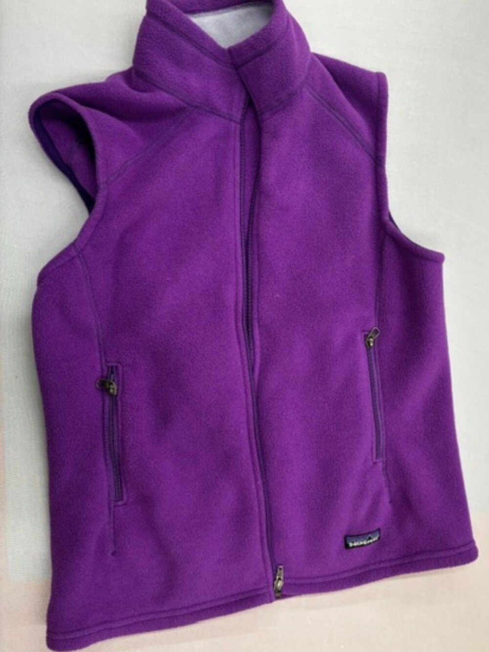 Purple Patagonia Synchilla fleece vest with a full-zip closure
